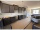 Kitchen featuring wooden cabinets, stainless sink, and granite countertops at 134 Royal Ave, Selma, NC 27576