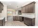 Modern kitchen with granite countertops, gray cabinets, and stainless steel appliances at 134 Royal Ave, Selma, NC 27576