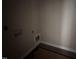 An unfinished laundry room with hook ups and modern vinyl flooring at 134 Royal Ave, Selma, NC 27576