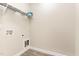 Large, bright laundry room with white walls, modern flooring, and washer/dryer hookups at 134 Royal Ave, Selma, NC 27576