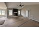 Spacious living room with a fireplace, vaulted ceilings, and large windows providing ample natural light at 134 Royal Ave, Selma, NC 27576