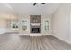 Open-concept living room featuring a stone fireplace and hardwood floors at 134 Royal Ave, Selma, NC 27576