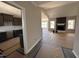 Spacious living room with a fireplace and mantel, open floor plan to kitchen at 134 Royal Ave, Selma, NC 27576