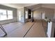 Spacious living room with large windows, a fireplace and mantel, open floor plan to kitchen at 134 Royal Ave, Selma, NC 27576