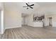 Spacious living room open to the kitchen with modern finishes and hardwood floors at 134 Royal Ave, Selma, NC 27576