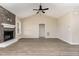 Open-concept living room featuring a stone fireplace, vaulted ceiling and hardwood floors at 134 Royal Ave, Selma, NC 27576