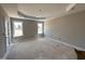 Spacious main bedroom with tray ceiling and large windows for natural light at 134 Royal Ave, Selma, NC 27576