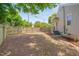 Side yard with wood privacy fence and mulched area for landscaping or recreation at 1429 Hudson Ave, Durham, NC 27705