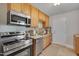 Well-equipped kitchen featuring stainless steel appliances and convenient layout at 1429 Hudson Ave, Durham, NC 27705