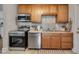 Kitchen featuring stainless steel appliances, ample counter space, and light-colored cabinets at 1429 Hudson Ave, Durham, NC 27705