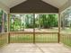 Secluded back porch overlooking a private backyard with mature trees and a lush lawn at 1481 Carolina Dr, Sanford, NC 27332