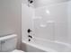 Clean bathroom featuring new fixtures, a bathtub with shower, and a toilet at 1481 Carolina Dr, Sanford, NC 27332
