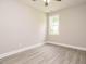 Cozy bedroom with neutral walls features a window letting in plenty of natural light at 1481 Carolina Dr, Sanford, NC 27332