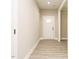 Inviting entryway with hardwood floors, neutral paint, and a new front door with glass panes at 1481 Carolina Dr, Sanford, NC 27332