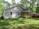 Charming house with manicured lawn and a new porch overlooking the backyard at 1481 Carolina Dr, Sanford, NC 27332