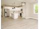Bright kitchen with white cabinets, stainless steel appliances, and center island offers modern appeal at 1481 Carolina Dr, Sanford, NC 27332