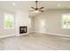 Spacious living room featuring a modern fireplace, recessed lighting, and a ceiling fan at 1481 Carolina Dr, Sanford, NC 27332