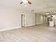 Open floor plan connecting the living room and kitchen, featuring light wood-look flooring at 1481 Carolina Dr, Sanford, NC 27332