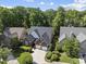 Beautiful brick home with a dark roof and manicured green bushes in a suburban neighborhood at 156 Yorkchester Way, Raleigh, NC 27615