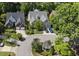 Aerial view of a house with a circular driveway and gazebo in a tree-filled suburban neighborhood at 156 Yorkchester Way, Raleigh, NC 27615