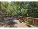 Inviting back deck area featuring outdoor seating, perfect for relaxation and entertaining at 156 Yorkchester Way, Raleigh, NC 27615