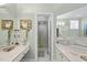 Well-lit bathroom featuring a vanity area and glass-enclosed shower for a functional and stylish design at 156 Yorkchester Way, Raleigh, NC 27615