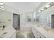 Spacious bathroom with dual sinks, white cabinetry, and a soaking tub, offering a spa-like experience at 156 Yorkchester Way, Raleigh, NC 27615