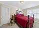 Comfortable bedroom featuring a bed, bedside table, natural light, and cozy ambiance at 156 Yorkchester Way, Raleigh, NC 27615