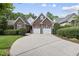 Charming brick home with a two-car garage and well-maintained landscaping at 156 Yorkchester Way, Raleigh, NC 27615