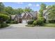 A well-kept brick house featuring manicured bushes and a neatly paved driveway at 156 Yorkchester Way, Raleigh, NC 27615