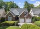 Charming brick home with a two-car garage and well-manicured landscaping in a suburban setting at 156 Yorkchester Way, Raleigh, NC 27615