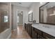 Bathroom featuring double vanity, neutral tile, and a separate tub and shower at 1641 Silo Ridge Dr, Wake Forest, NC 27587