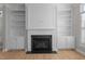 A fireplace with built in bookcases and cabinets provides a wonderful focal point at 1641 Silo Ridge Dr, Wake Forest, NC 27587
