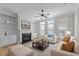 Bright living room features a fireplace, built-in bookshelves, neutral tones, and an area rug at 1641 Silo Ridge Dr, Wake Forest, NC 27587