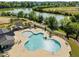Community pool with unique design featuring ample seating and a small splash area at 1641 Silo Ridge Dr, Wake Forest, NC 27587