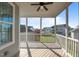 Relaxing screened porch with ceiling fan, wooden floors, and neighborhood views at 1641 Silo Ridge Dr, Wake Forest, NC 27587