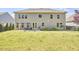 Large backyard with ample green space, patio area, and garden beds, perfect for outdoor activities and relaxation at 1808 Capstone Dr, Durham, NC 27713