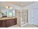 Bathroom with a glass enclosed shower, granite vanity, and neutral color scheme at 1808 Capstone Dr, Durham, NC 27713