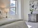 Stylish bedroom detail with modern decor, a comfortable bed and natural light at 1808 Capstone Dr, Durham, NC 27713