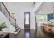 Grand foyer with high ceilings, dark hardwood floors, and elegant staircase at 1808 Capstone Dr, Durham, NC 27713