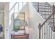 Staircase with dark wood floors, a wooden handrail, and natural light at 1808 Capstone Dr, Durham, NC 27713