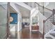 Spacious foyer with dark wood floors, a staircase, and an open floor plan at 1808 Capstone Dr, Durham, NC 27713