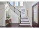 Bright foyer with high ceilings, natural light, and a beautiful staircase at 1808 Capstone Dr, Durham, NC 27713