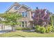 Landscaped front yard and brick facade with a welcoming entrance to this lovely home at 1808 Capstone Dr, Durham, NC 27713