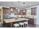 Elegant kitchen featuring a large island, pendant lighting, and sleek, dark cabinets at 1808 Capstone Dr, Durham, NC 27713