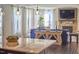 Light filled living room with hardwood flooring, stone fireplace and built in television at 1808 Capstone Dr, Durham, NC 27713