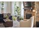 Well-lit living room with stone fireplace, fiddle leaf fig, and comfortable seating at 1808 Capstone Dr, Durham, NC 27713
