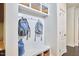 Mudroom featuring built-in storage, a bench, and coat hooks near an interior door at 1808 Capstone Dr, Durham, NC 27713