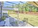 Inviting patio area with comfortable seating, ideal for outdoor dining and entertaining amidst a lush backyard setting at 1808 Capstone Dr, Durham, NC 27713