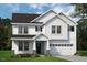 Charming two-story home with shingle accents, dark shutters, well maintained lawn, and two-car garage at 1891 Ballard Rd # 192, Fuquay Varina, NC 27526